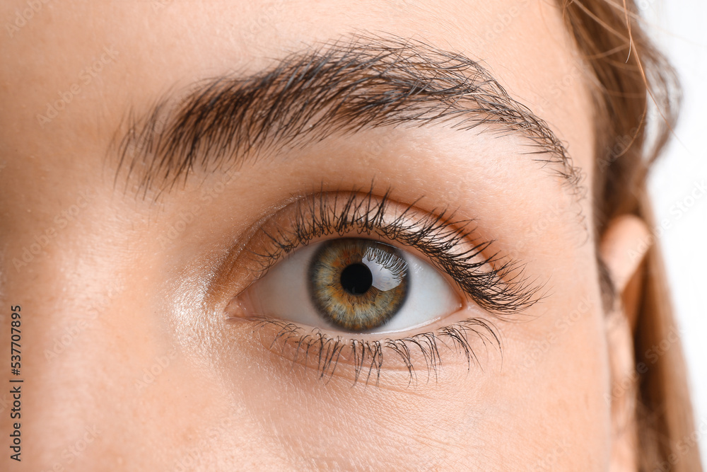 Young woman with beautiful hazel eyes on white background, closeup Young woman with beautiful hazel eyes on white background, closeup