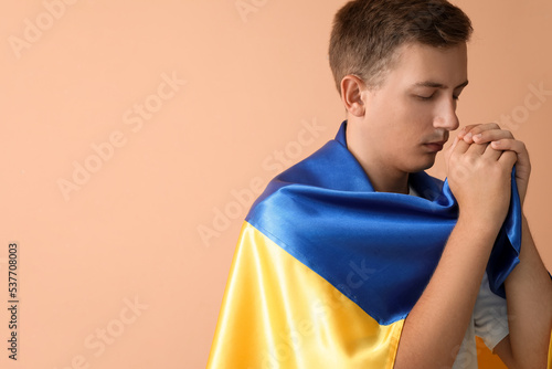 Young man with flag of Ukra...