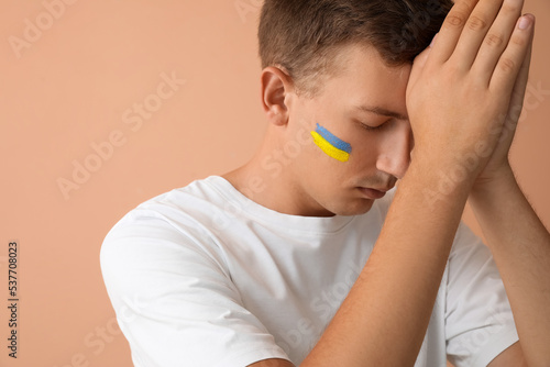 Young man with drawn flag o...