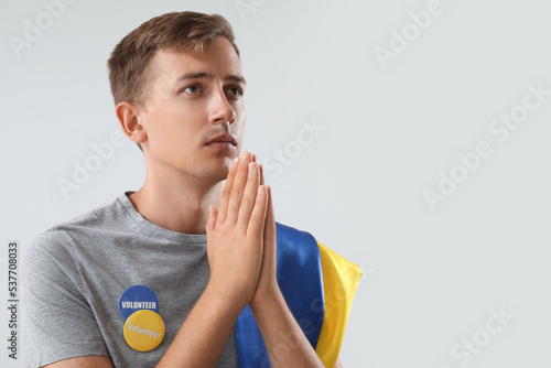Male volunteer with badges ...
