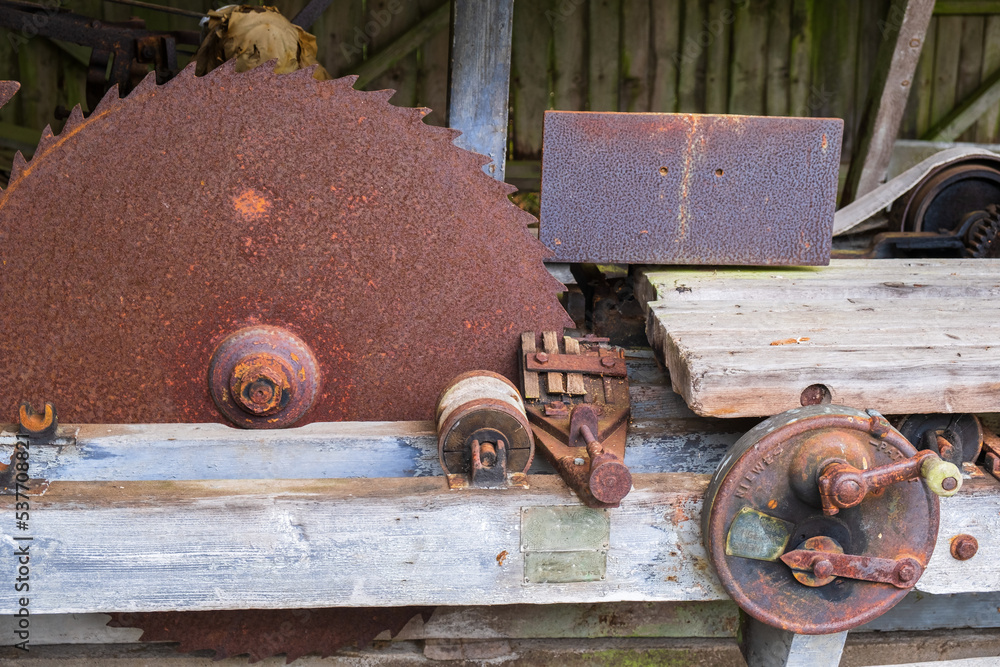 Old rusty circular saw in a sawmill Old rusty circular saw in a sawmill