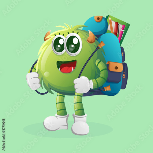 Cute green monster carrying a schoolbag, backpack, back to school