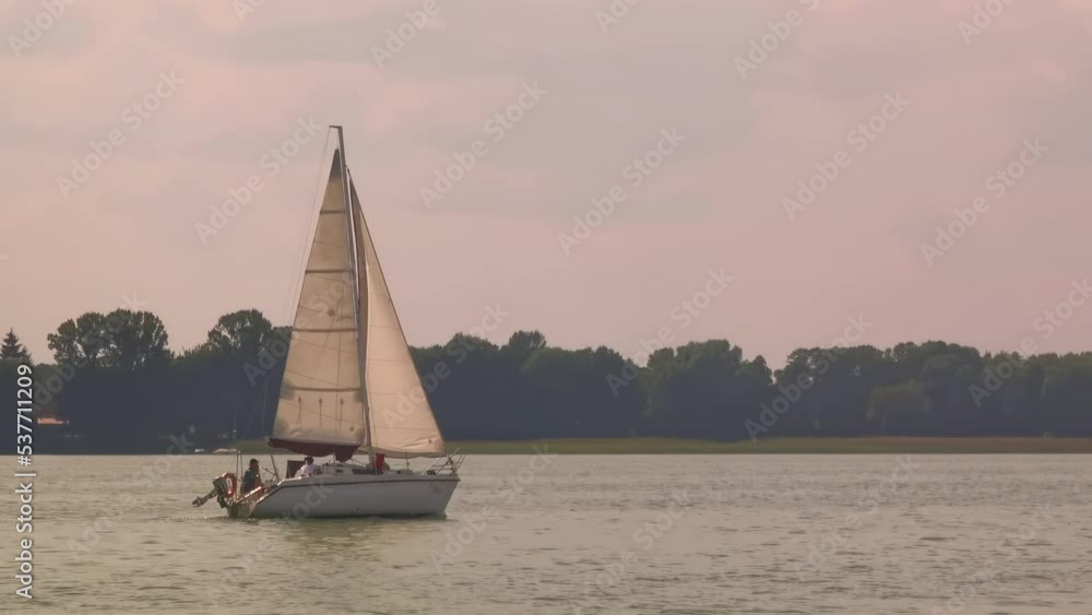Sailing boat in the sea during awesome sunset. Luxury yacht and cruise holiday. Sailing boat in the sea during awesome sunset. Luxury yacht and cruise holiday.