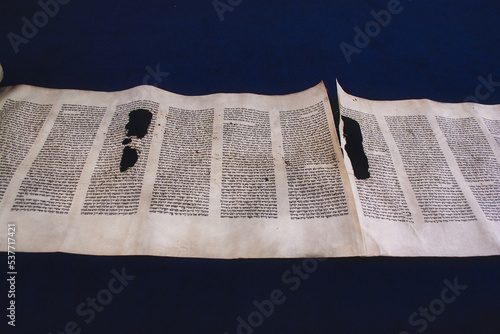 Ancient Hebrew text of the Book of Genesis in the Torah scroll. Torah chapter read every Sabbath in a synagogue. Conversion Judaism
