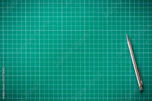 Plastic green cutting mat texture. squared sheet texture green background