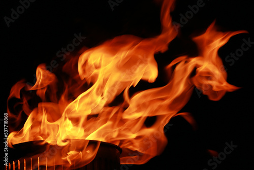 Abstract fire flames from torch, isolated on black background