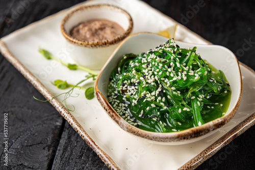 Photography delicious chuka seaweed with nut sauce and lemon