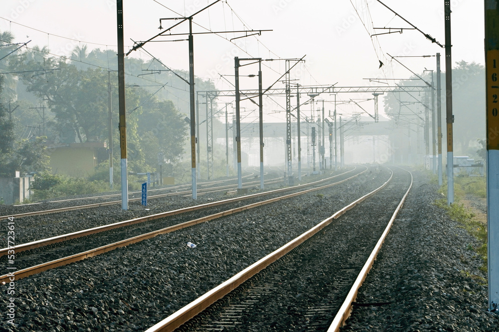 Railway in the fog. Indian railway track in winter season. Foggy winter morning. Mist in the train tracks. Railway in the fog. Indian railway track in winter season. Foggy winter morning. Mist in the train tracks.