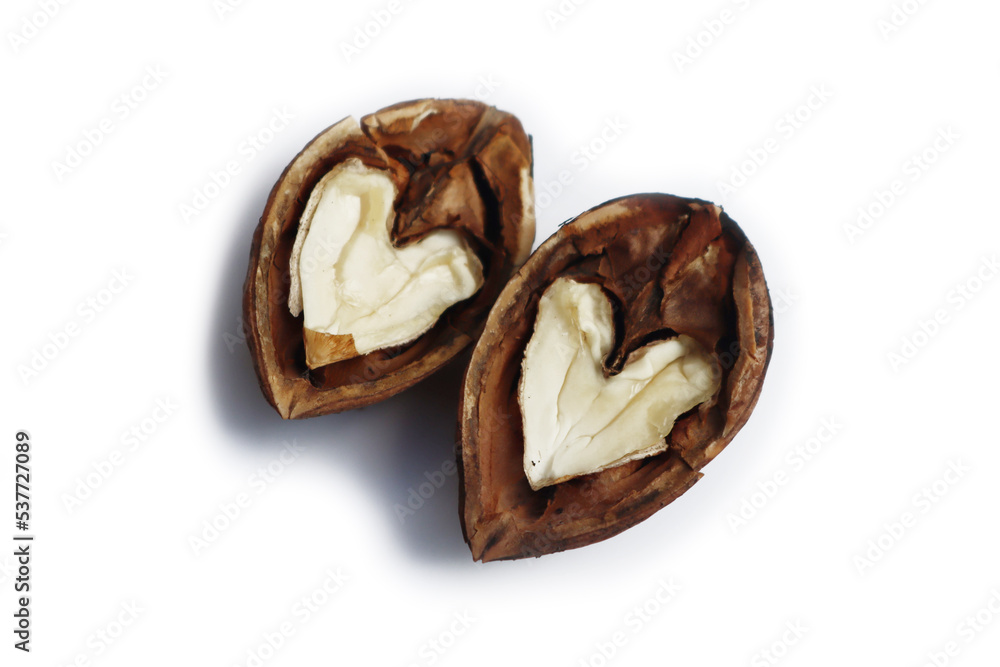 Two half walnut in shape of heart isolated on white background