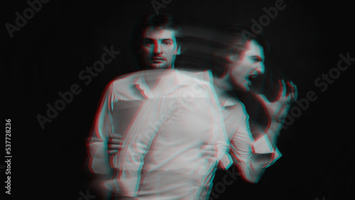 Abstract blurry portrait of a schizophrenic man with mental disorders and bipolar split personality. Black and white with 3D glitch virtual reality effect photo