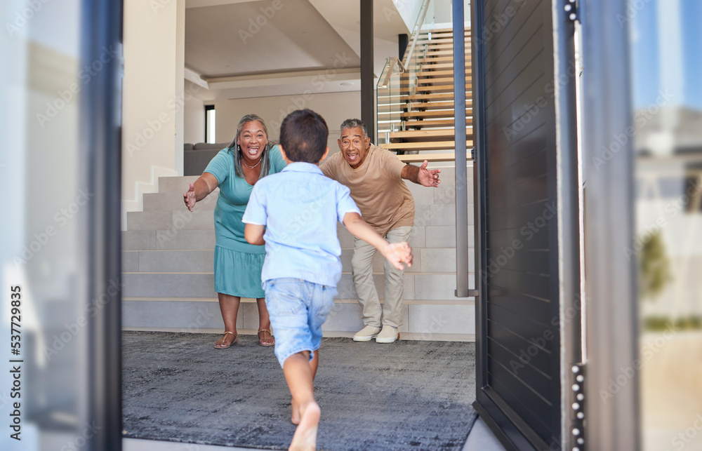 Excited kid running to grandparents in family home meeting, greeting and hugging with love, care and happiness. Elderly man, senior woman and happy people welcome grandson child at front door house