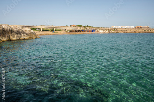 Beach with sand and blue and transparent water called Cravettone or Calafarina in Pachino