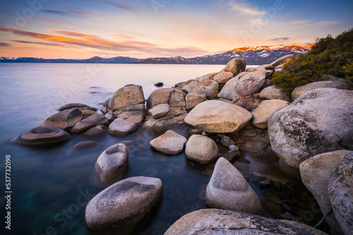 beautiful Lake tahoe at sunset with reflection in water.