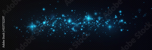 Particles of white magic dust. Shining light particles.Christmas glitter particles. Light effect on a transparent background.