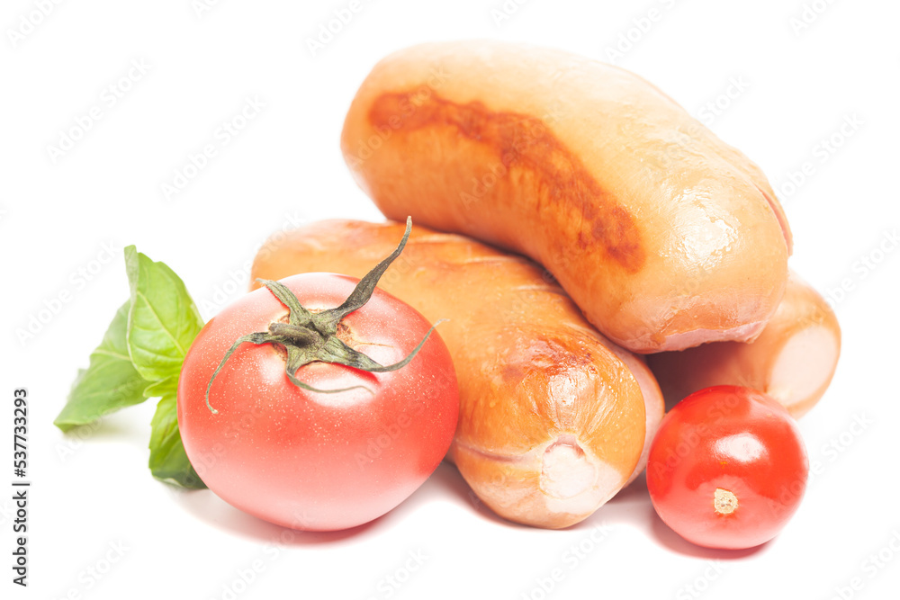 grilled sausages with tomatoes and green basil leaves isolated on white background grilled sausages with tomatoes and green basil leaves isolated on white background