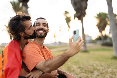 Happy couple taking selfie photo. LGBT community © JustLife