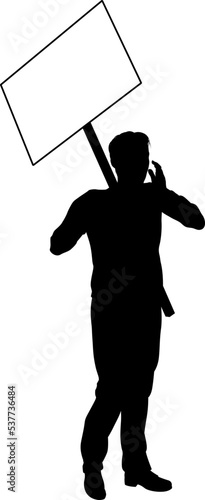 Protestor or demonstrator at a demonstration march, picket line or strike protest rally in silhouette. Holding up a banner or picket sign board placard.