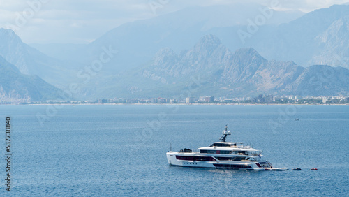 Ship yacht in the sea among the mountains in the fog © Ekaterina