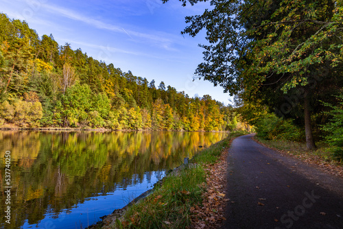Road along the Vltava river in the autumn season.