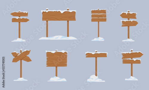 Vintage wooden sings covered with snow vector illustrations set. Snowy signboards, signposts or banners from wood, arrow signs isolated on grey background. Winter, direction, information concept