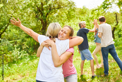 Two women celebrate victory in outdoor competition