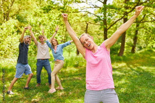 Sporty young woman rejoices in a success