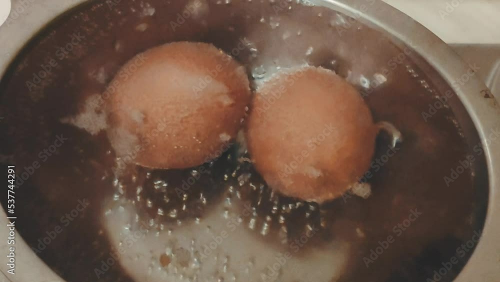 Boiled eggs in metal pan close up. Boiled eggs in metal pan close up.