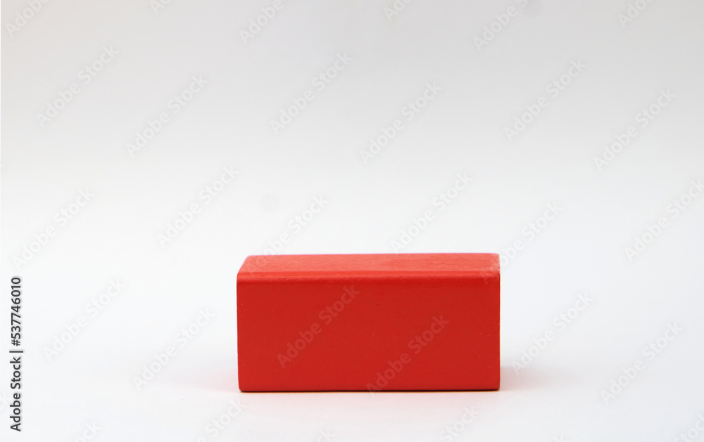 red wooden block on white background