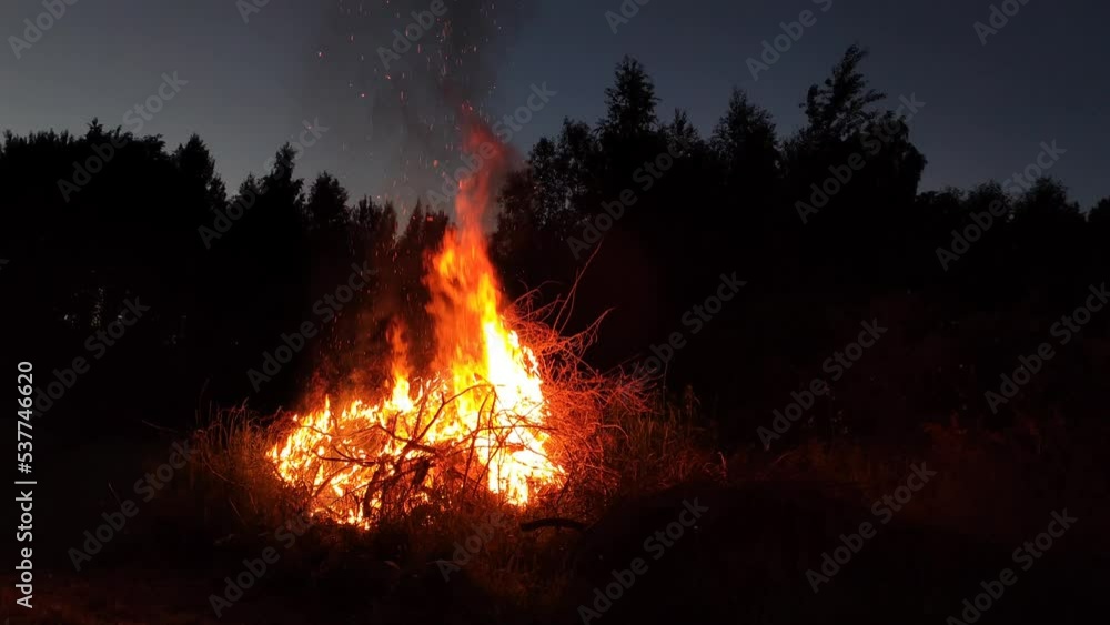Bonfire outdoors on summer nature background. Bonfire outdoors on summer nature background.