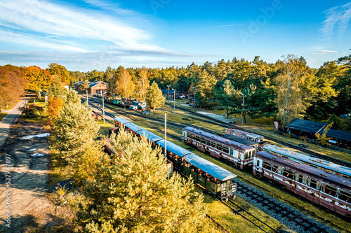 zabytkowa stacja kolejowa, muzeum kolei wąskotorowej w Rudach na Śląsku w Polsce, panorama z lotu ptaka jesienią. photo