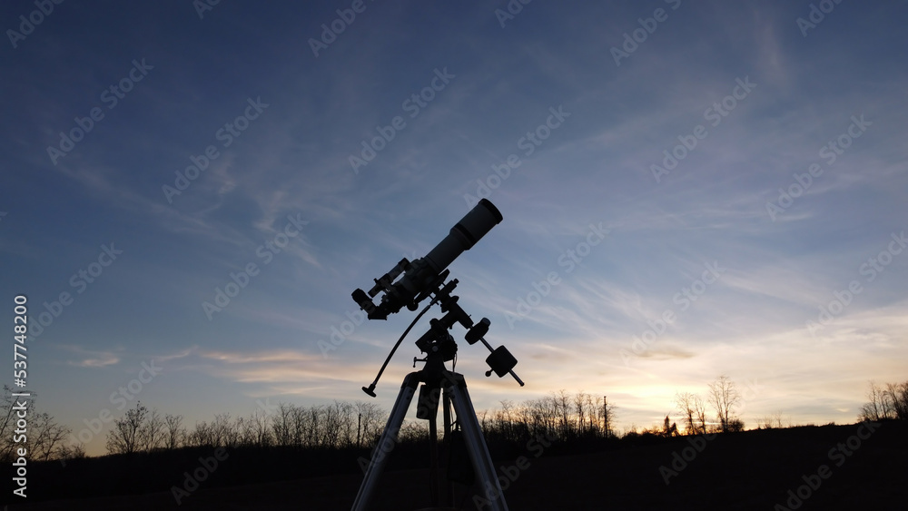 Silhouette of a telescope for observing space and astronomy objects.