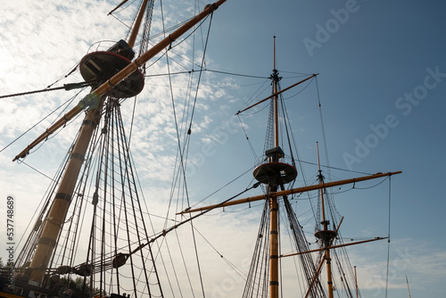 Masts, yards and rigging of sailing ship against blue sky