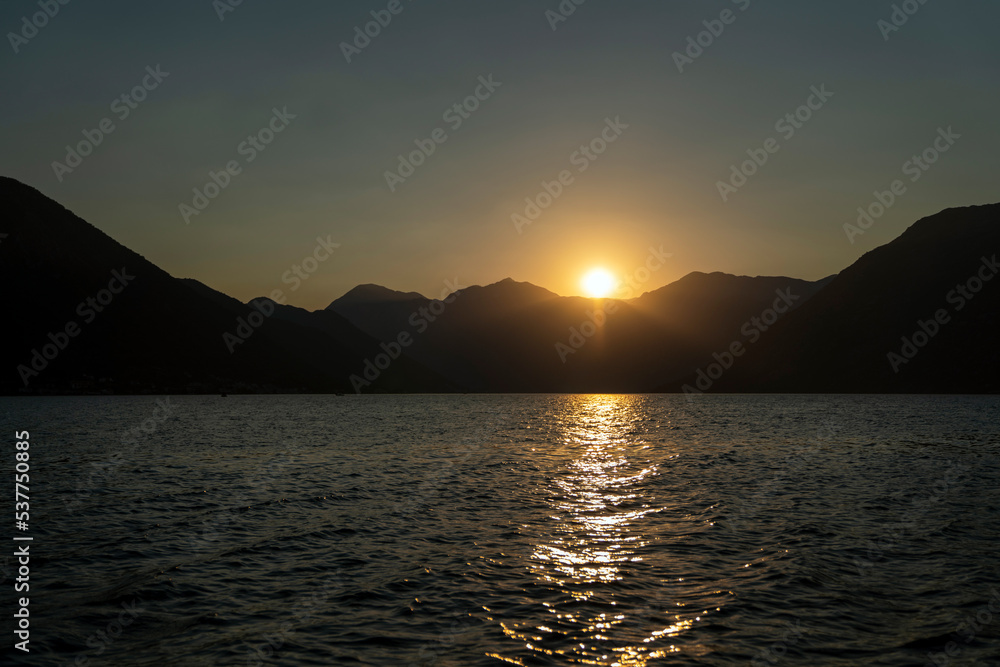 Sea landscape over the blue mountain in sunset. Summer travel vacation concept.