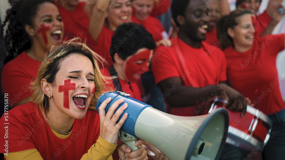 Football fans exulting during soccer game of their favorite team - Sport entertainment concept Football fans exulting during soccer game of their favorite team - Sport entertainment concept