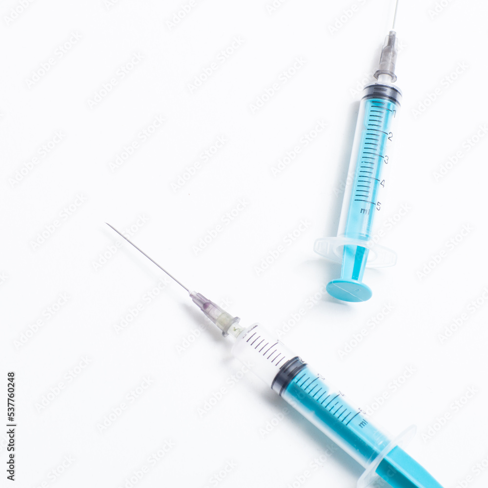 Disposable plastic syringe prepared for injection and vaccination in the hospital. The concept of medicine and health Disposable plastic syringe prepared for injection and vaccination in the hospital. The concept of medicine and health