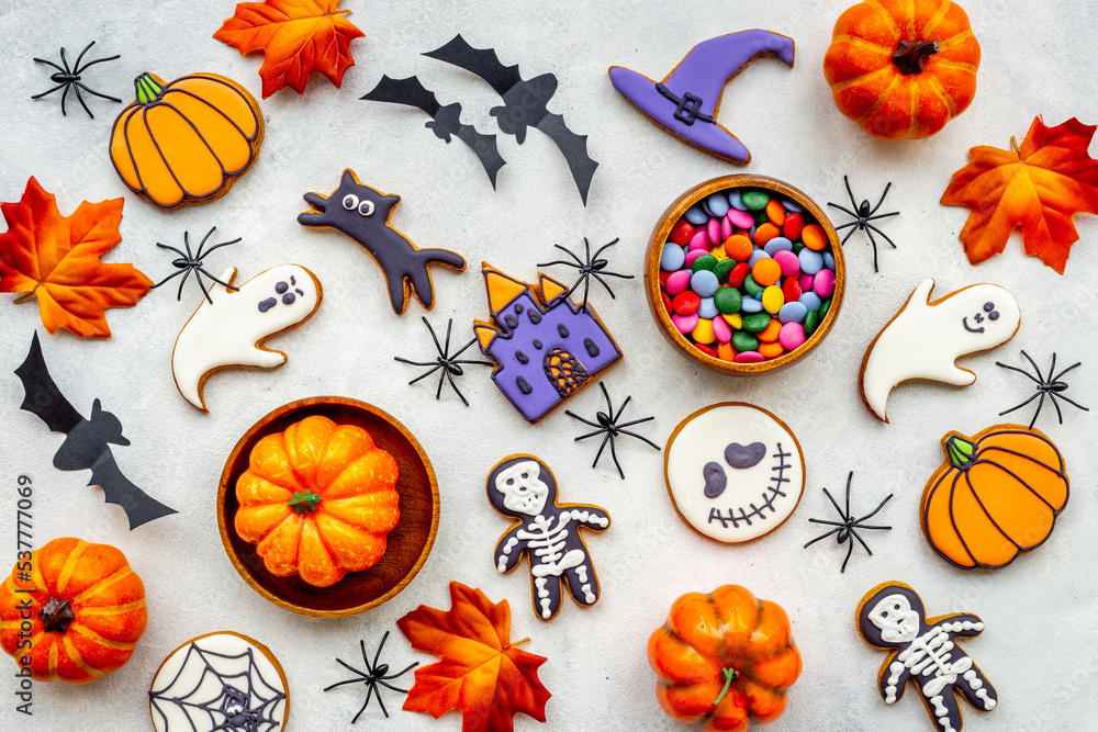 Flat lay pattern of halloween cookies and sweets. Party background Flat lay pattern of halloween cookies and sweets. Party background