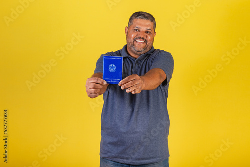 Brazilian black man, adult with Work Card and Social Security, retirement. labor market.