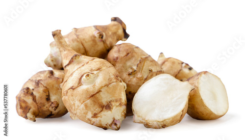 Heap of Jerusalem artichoke and pieces on a white background. Isolated