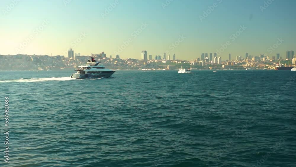 Yacht crossing Bosphorus strait in Istanbul city Yacht crossing Bosphorus strait in Istanbul city