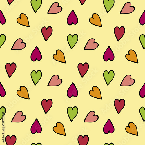 Seamless pattern with multicolored hearts on light yellow background. Vector image.