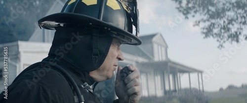Quadro em tela Firefighter chief talking on CB radio and giving orders to his crew, fireman fig
