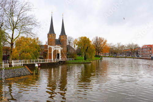 The Eastern gate in Delft ,  Brick Gothic northern European architecture gate and towers during autumn , winter : Delft , Netherlands : November 28 , 2019 © fukez84