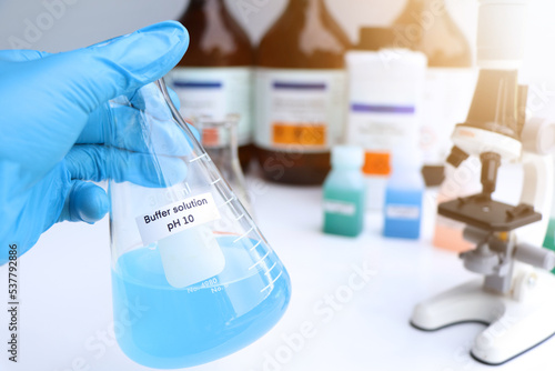 Buffer solution in glass, chemical in the laboratory and industry photo
