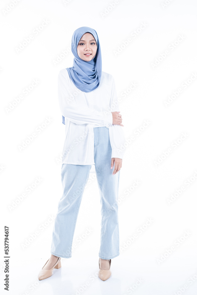 Portrait of a beautiful Muslim female model wearing modern and stylish casualwear with hijab isolated white studio background. Modern hijab fashion and beauty concept Portrait of a beautiful Muslim female model wearing modern and stylish casualwear with hijab isolated white studio background. Modern hijab fashion and beauty concept