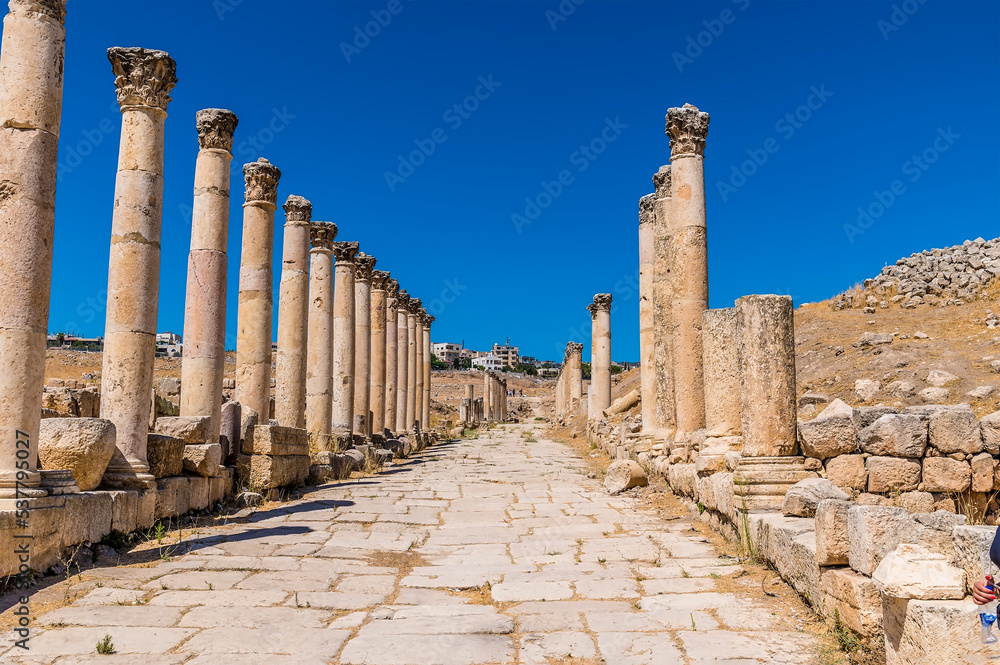 A view down the colonnaded main street in the ancient Roman settlement of Gerasa in Jerash, Jordan in summertime