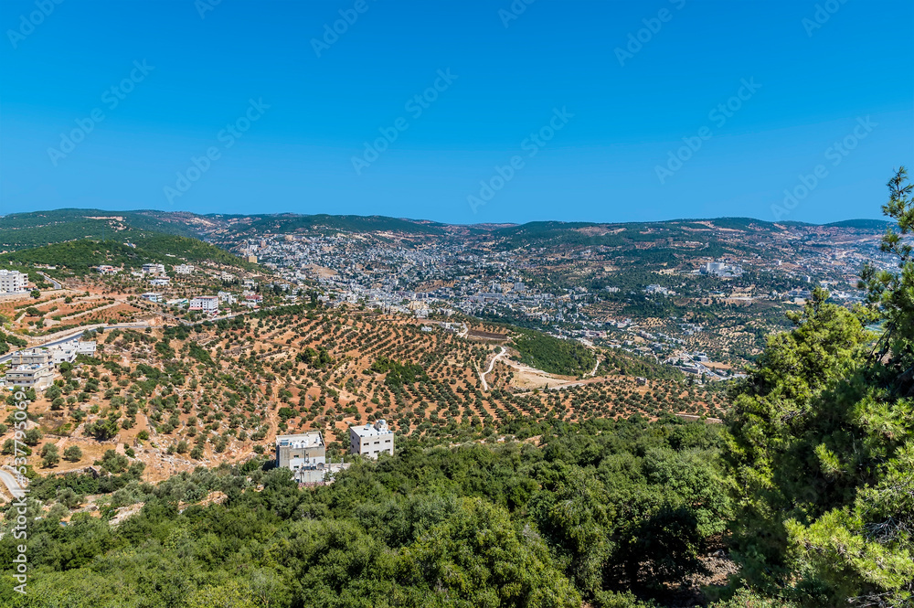 Obraz premium A view across the valley below Ajloun Castle, Jordan in summertime