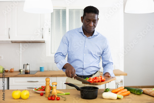Man preparing food at home photo