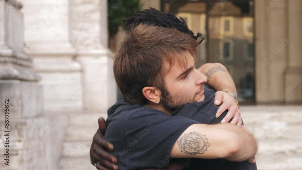 Two friends greet each other. Caucasian man and African American man Two friends greet each other. Caucasian man and African American man