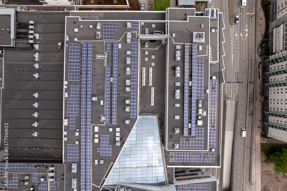 Solar panels on the roof of a shopping mall building