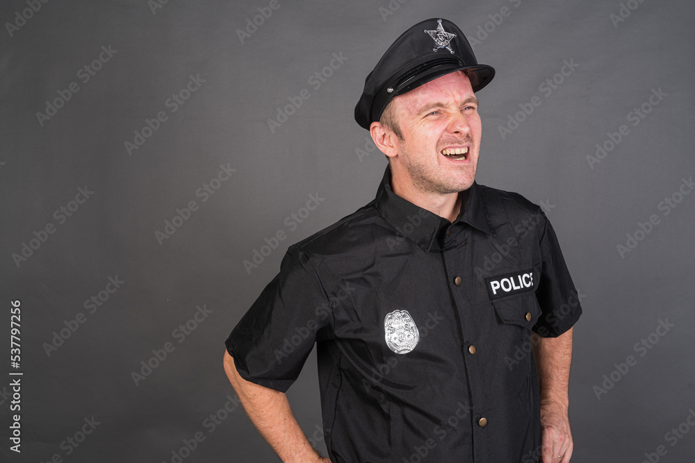 Portrait of Caucasian man wearing police uniform costume Portrait of Caucasian man wearing police uniform costume